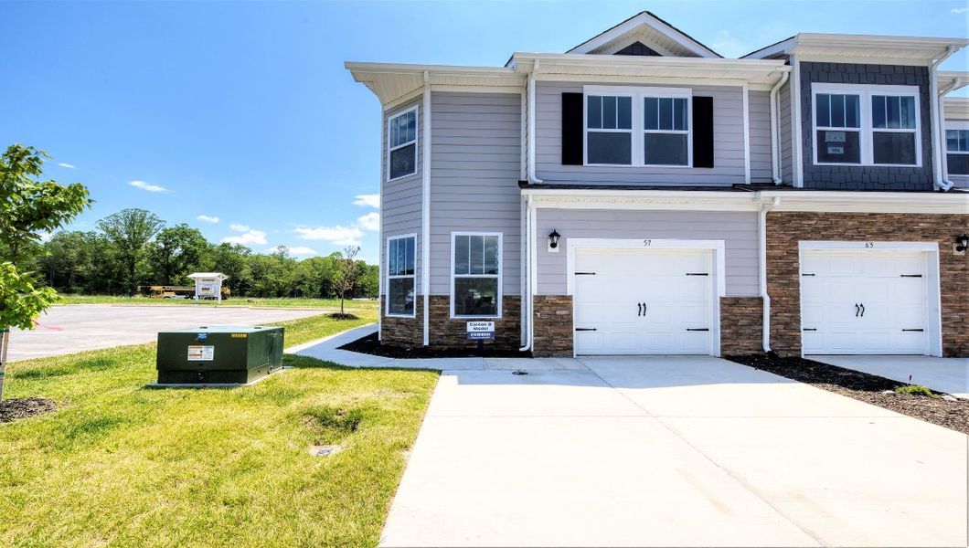 Front exterior of a home in the The Townes at Stonecrest community, located in Hendersonville, NC (Image 1). Front exterior of a home in the The Townes at Stonecrest community, located in Hendersonville, NC (Image 1).