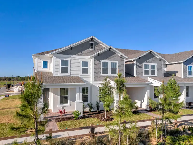 Front exterior of a home in the Harvest at Ovation - Townhomes community, located in Winter Garden, FL (Image 37).