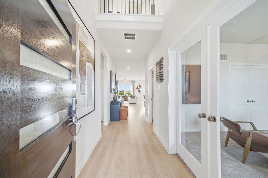 A hallway with white doors.