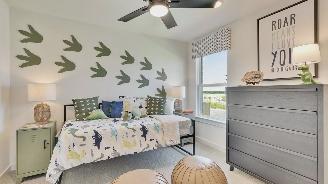 Chic children's room in Hunters Glen boasts dinosaur accents and sophisticated modern finishes. Chic children's room in Hunters Glen boasts dinosaur accents and sophisticated modern finishes.