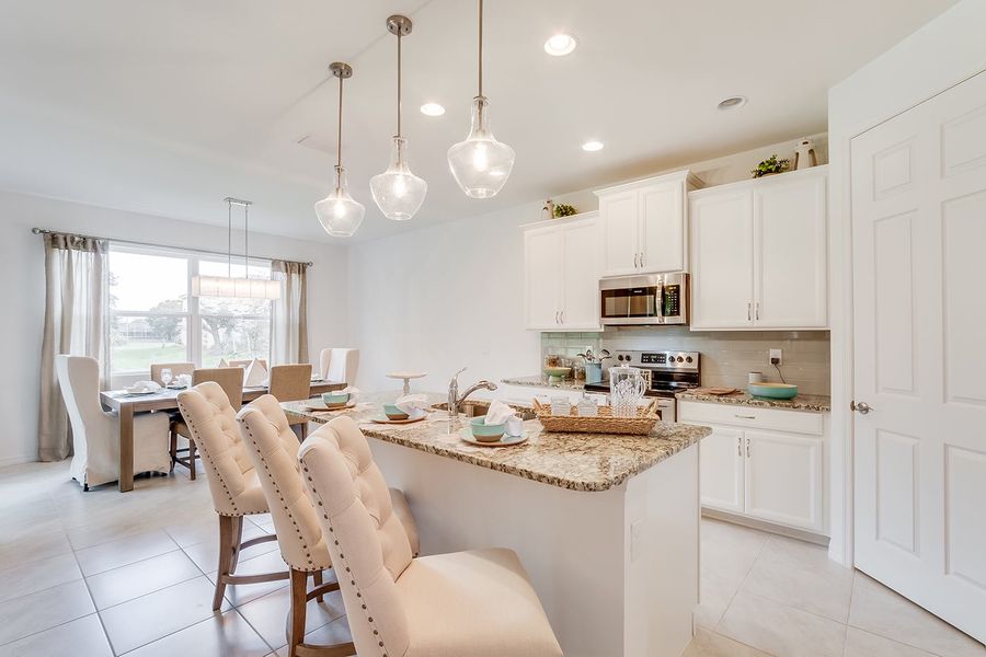 Furnished interior in a model home at Deep Creek Tradition Series in Punta Gorda (Image 7).