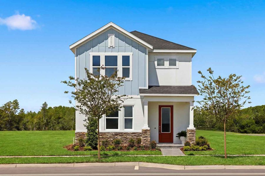 Front exterior of a home in the Palmeras at Crossprairie – The Magnolia Collection community, located in St. Cloud, FL (Image 3).