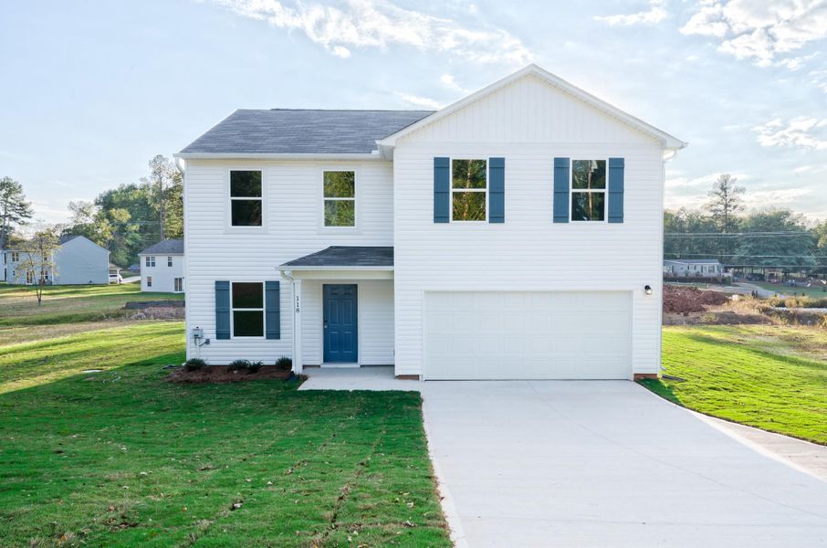 A white house with blue shutters.