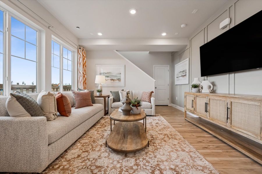 A living room with a large tv.