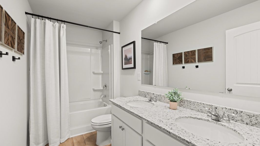 Furnished interior in a model home at Northwoods at Mirror Lake in Villa Rica (Image 31).