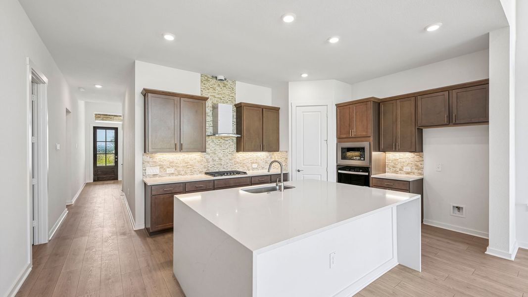 Furnished interior in a model home at The Enclave at Bar W Ranch in Leander (Image 8).