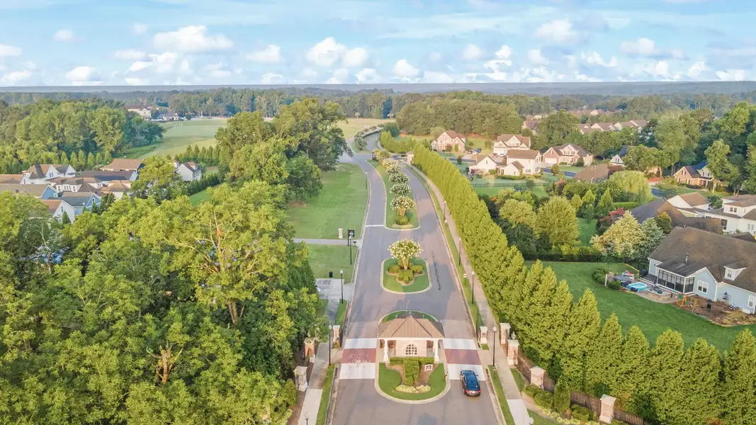Aerial view of the South Lake Townes at Flowers Plantation community in Clayton, NC, showing layout and nearby surroundings (Image 17).