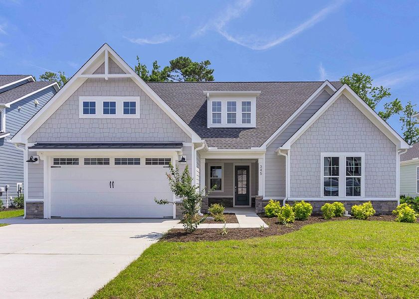 Front exterior of a home in the WyndWater community, located in Hampstead, NC (Image 29).