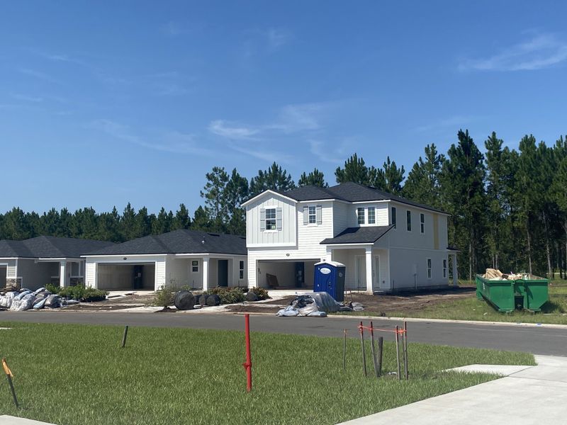 A modern two-story home under construction in Amberly by Dream Finders Homes (Green Cove Springs, FL). A modern two-story home under construction in Amberly by Dream Finders Homes (Green Cove Springs, FL).