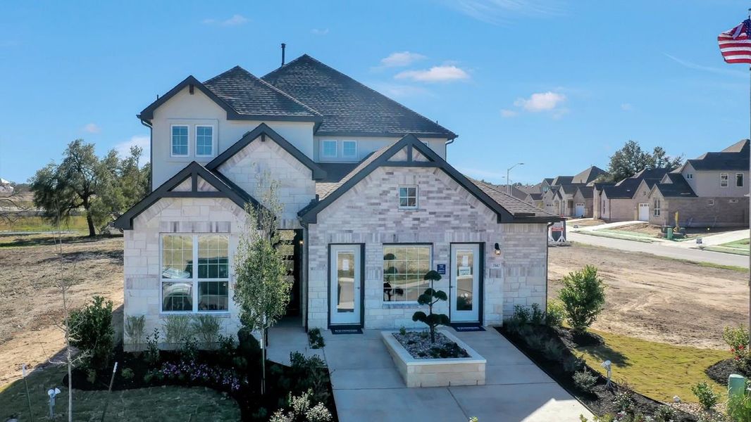 Front exterior of a home in the Rosenbusch Ranch community, located in Leander, TX (Image 2).