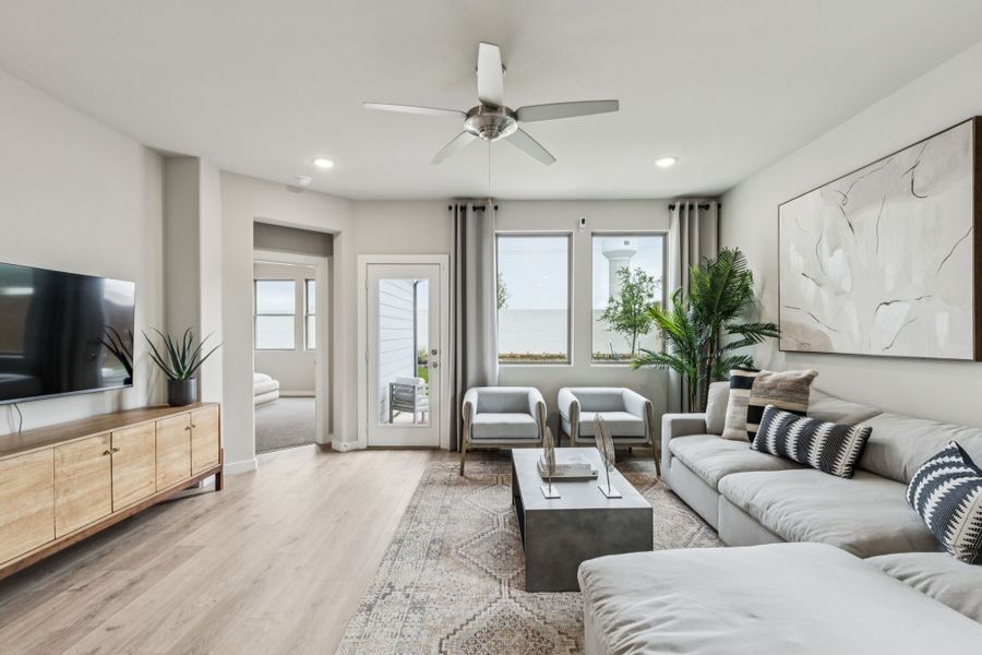 REPRESENTATIVE PHOTO – Living Room in a Lakehaven Oak model home in Farmersville TX by Trophy Signature Homes