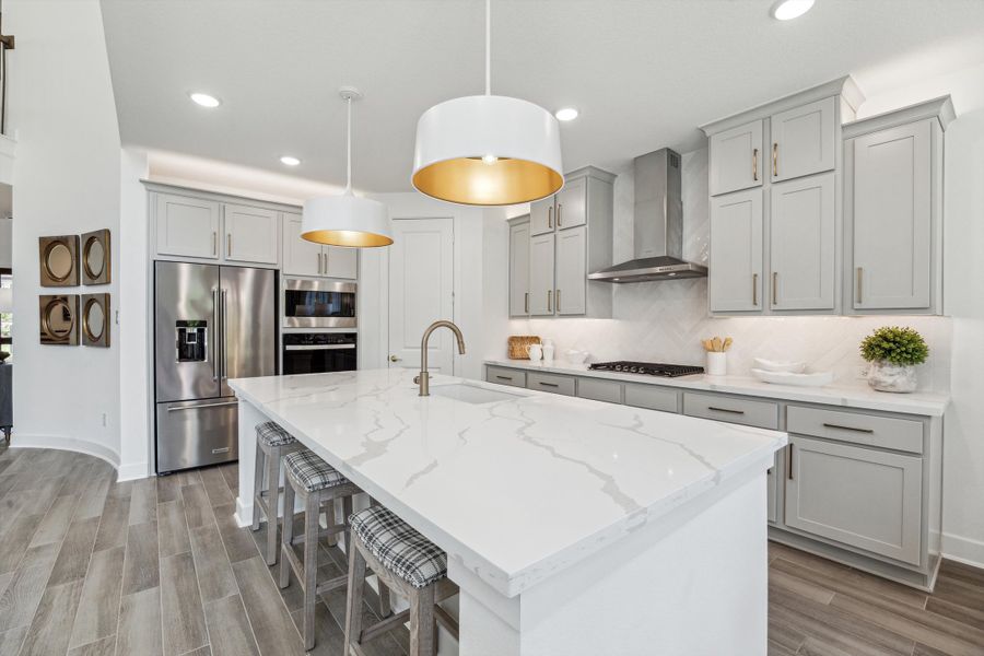 Furnished interior in a model home at The Woodlands Hills – 55' in Willis (Image 9).