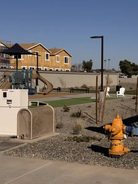 Under construction homes and a playground create a family-friendly vibe in Bethany Grove by Beazer Homes (Glendale, AZ).