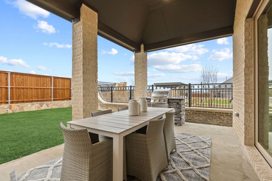 Covered patio in an Uptown Crossing new home in Allen TX by Trophy Signature Homes