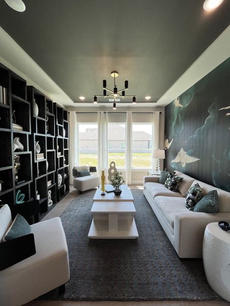 A chic living room with bold shelving, modern chandelier, and a statement wall with bird design. Luxurious and inviting atmosphere. A chic living room with bold shelving, modern chandelier, and a statement wall with bird design. Luxurious and inviting atmosphere.