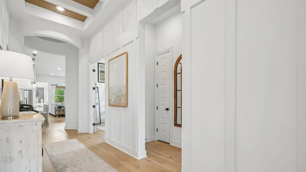 Bright white foyer featuring a rotunda, natural wood accents, and sophisticated interior design Bright white foyer featuring a rotunda, natural wood accents, and sophisticated interior design