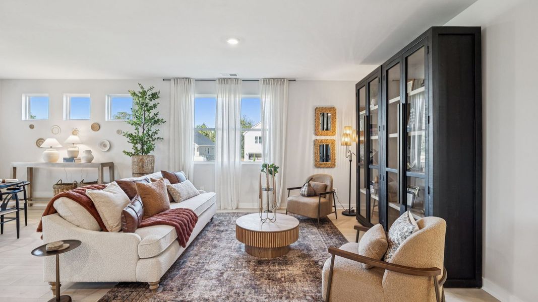 Furnished interior in a model home at Harvest Point in Spring Hill (Image 59).