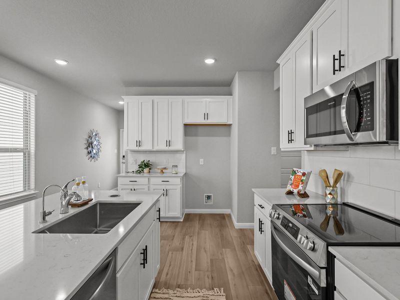 Furnished interior in a model home at Buffalo Way Villas in Houston (Image 10).