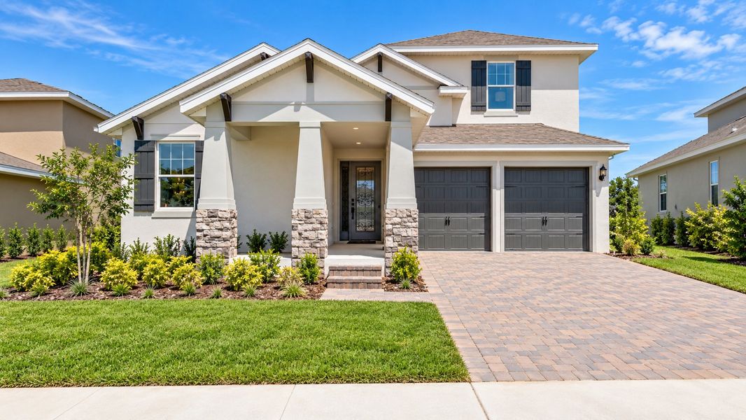 Front exterior of a home in the Hills of Minneola community, located in Minneola, FL (Image 10).