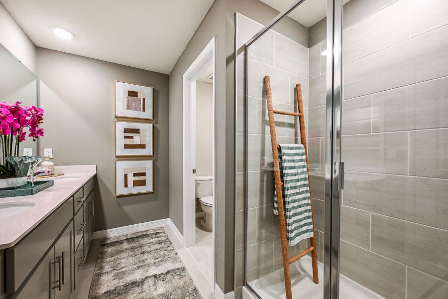 Furnished interior in a model home at Towns at Riverwalk: Lake Monroe TH in Sanford (Image 14).