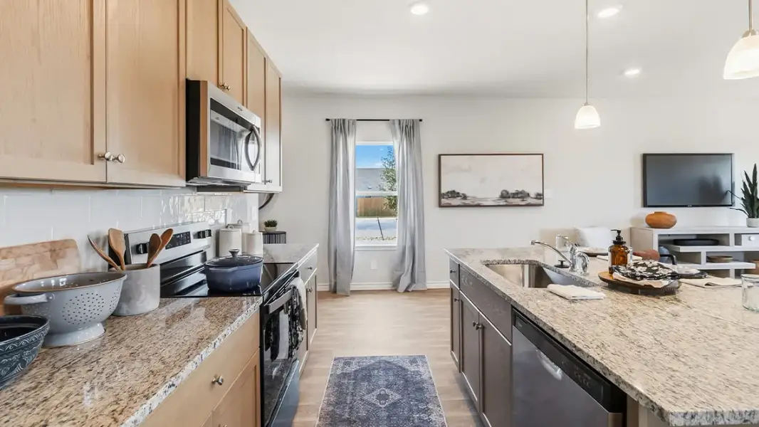 Furnished interior in a model home at Saddle Ridge Estates in Lytle (Image 15).