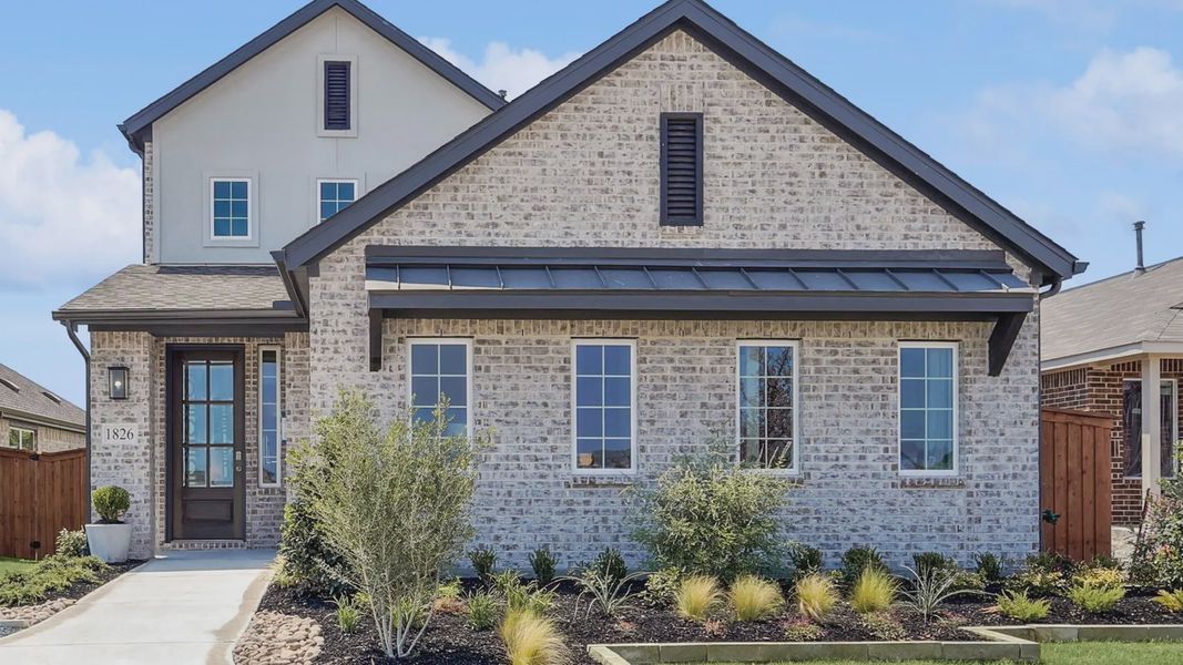 Stunning brick facade, expansive windows in Walden Pond. Elegant gabled roof complements manicured landscape.