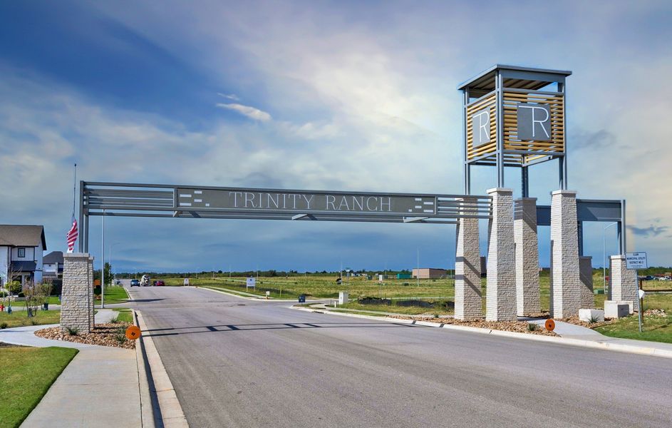 Entrance to the Trinity Ranch community in Elgin, TX, featuring signage and landscaping (Image 1).