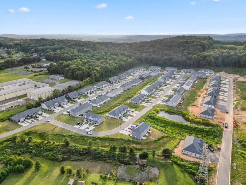 Aerial view of the Bellingham Townhomes community in Cleveland, TN, showing layout and nearby surroundings (Image 15).
