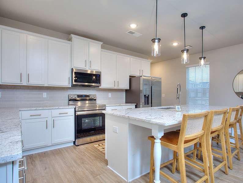 Furnished interior in a model home at Stone Brooke in Gray (Image 3). Furnished interior in a model home at Stone Brooke in Gray (Image 3).