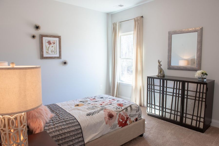 Furnished interior in a model home at Hidden Lake Preserve in Greenville (Image 13).