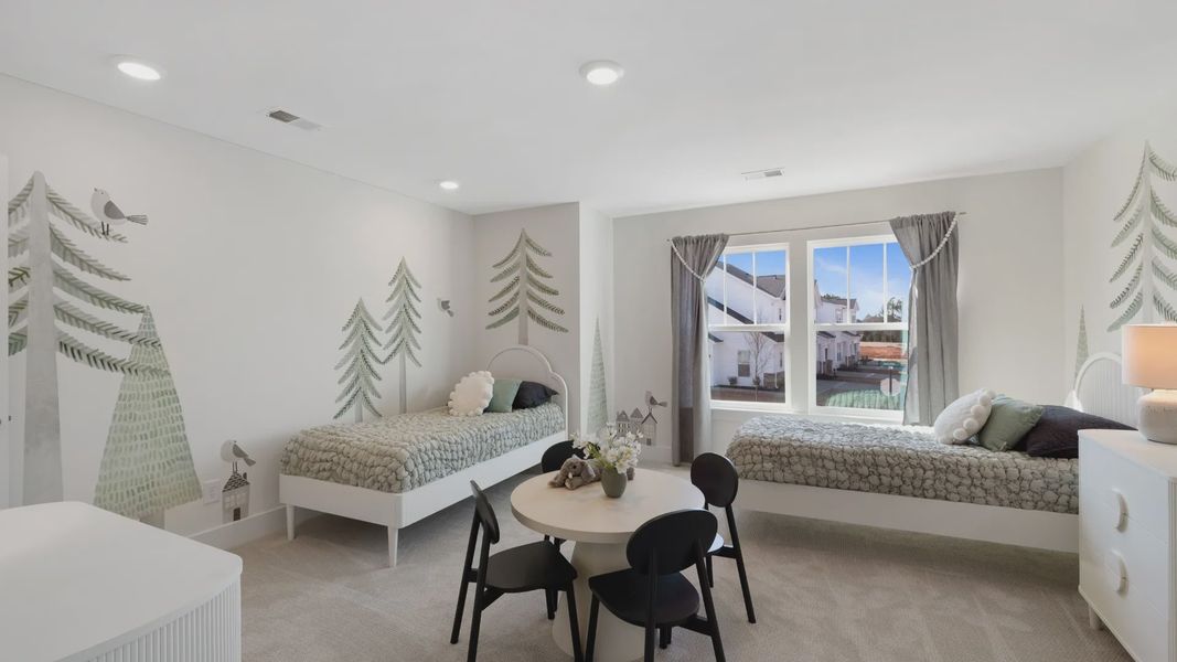 Childs room with nature wall paper, small single beds, tea table and natural finishes at Village at Midway by DRB Homes Childs room with nature wall paper, small single beds, tea table and natural finishes at Village at Midway by DRB Homes