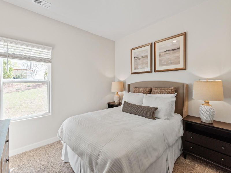 This secondary bedroom can make for a great guest room or home gym.