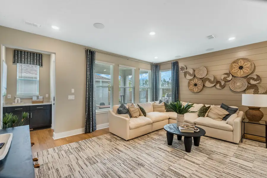 Furnished interior in a model home at Harvest at Ovation - Townhomes in Winter Garden (Image 58).