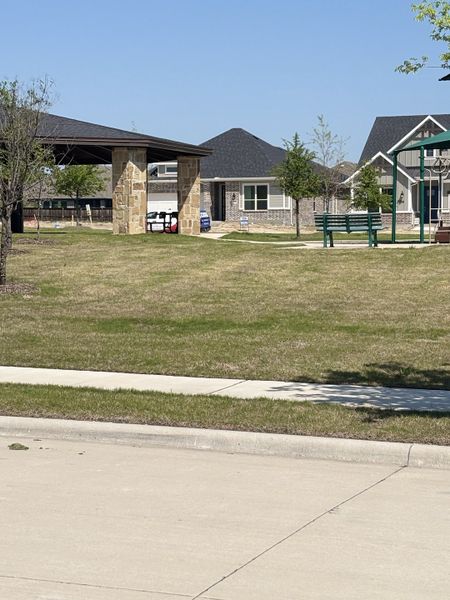 Scenic neighborhood with charming homes and a park in Bayside by Mattamy Homes (Rowlett, TX).