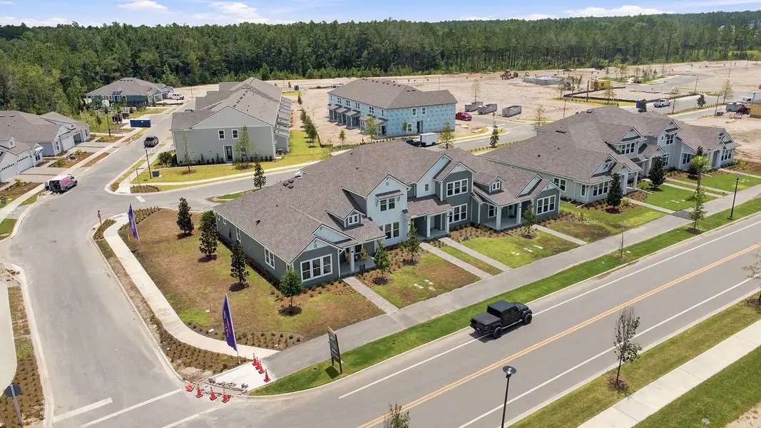 Aerial view of the Westerly Park at Wildlight - Courtyard Collection community in Yulee, FL, showing layout and nearby surroundings (Image 6). Aerial view of the Westerly Park at Wildlight - Courtyard Collection community in Yulee, FL, showing layout and nearby surroundings (Image 6).