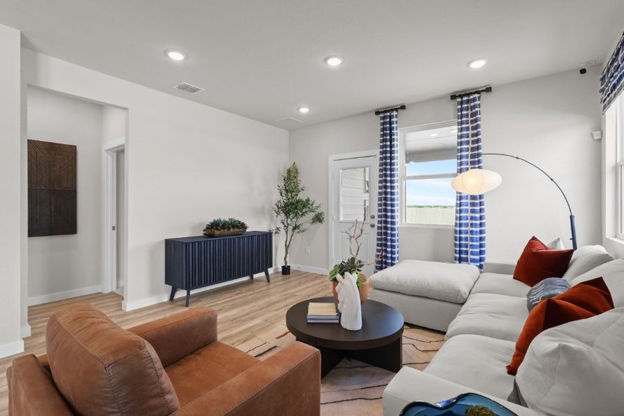 A living room with a couch and a coffee table.