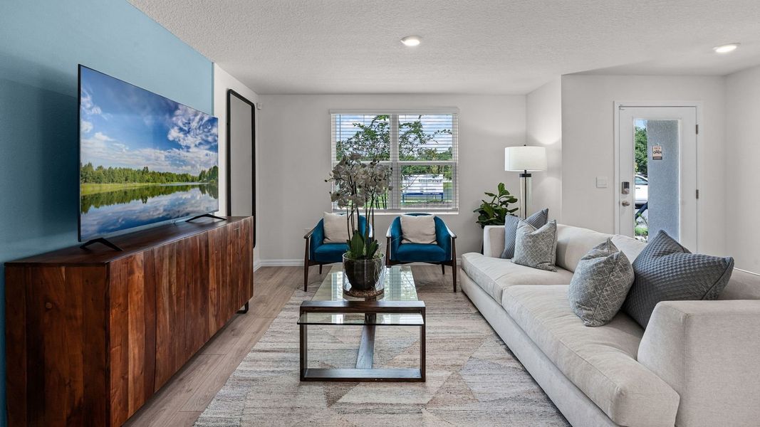 Furnished interior in a model home at Fish Lake Cove in Kissimmee (Image 23).