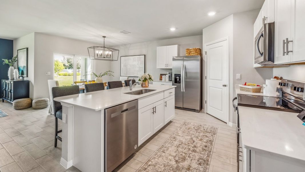 Furnished interior in a model home at Cali Cove in Punta Gorda (Image 7).