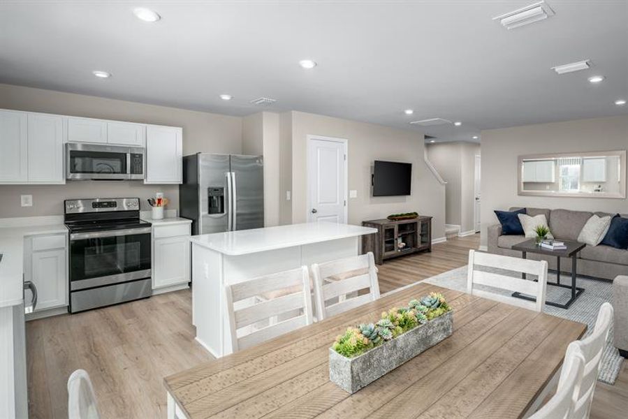 Furnished interior in a model home at West Main Townes in Sanford (Image 2).