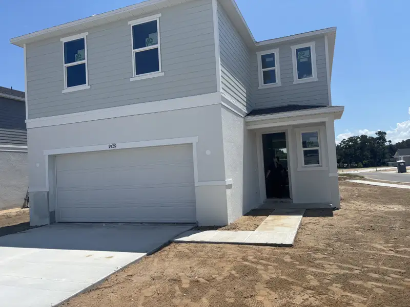 A modern two-story home with a double garage in Silver Lake Estates I by KB Home, Leesburg, FL.