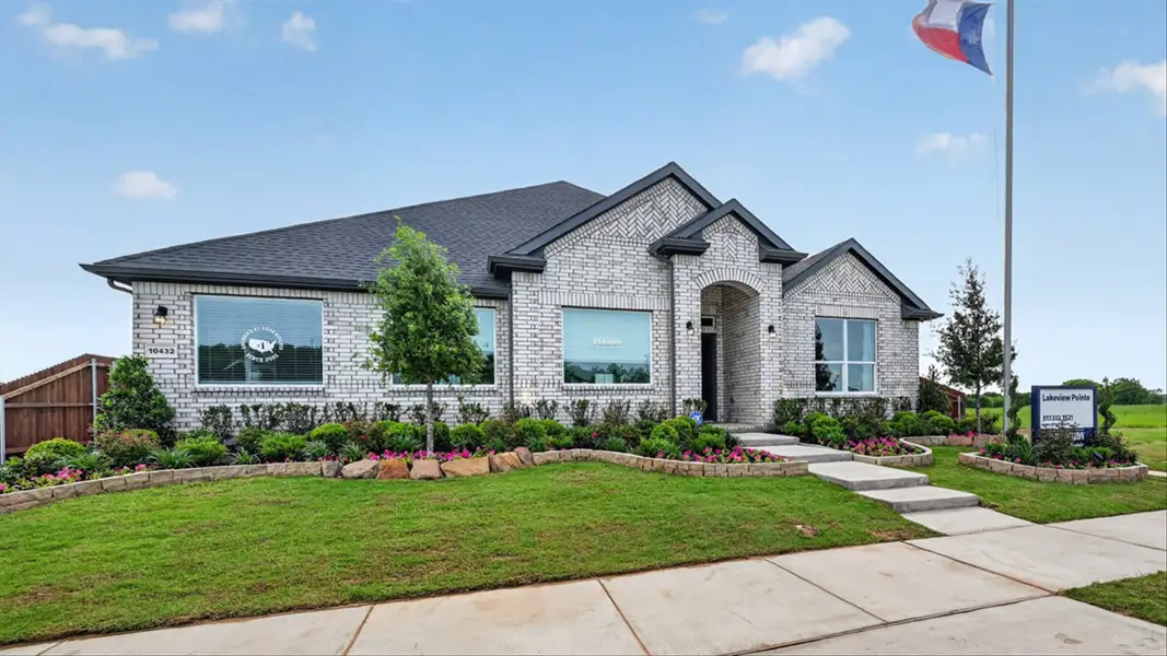 Front exterior of a home in the Lakeview Pointe community, located in Grand Prairie, TX (Image 9).