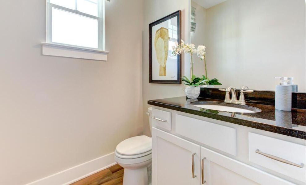 Furnished interior in a model home at CraigStone in Woodruff (Image 5).