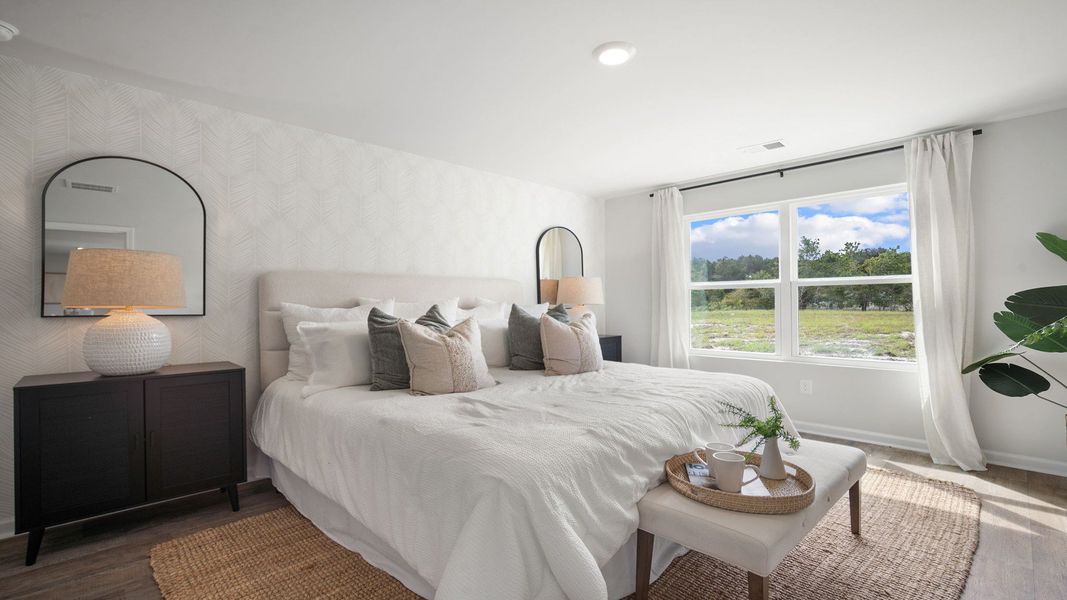 Furnished interior in a model home at The Groves at Bees Creek in Ridgeland (Image 7).