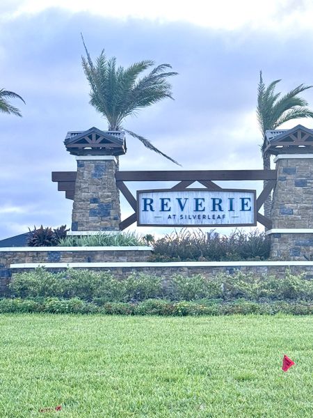 Scenic entrance with stone columns and lush landscaping at Reverie at Silverleaf by Dream Finders Homes (St. Augustine, FL). Scenic entrance with stone columns and lush landscaping at Reverie at Silverleaf by Dream Finders Homes (St. Augustine, FL).