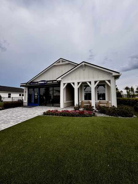 A charming white model home with a cozy porch in RiverTown - WaterSong by Mattamy Homes (St. Johns, FL). A charming white model home with a cozy porch in RiverTown - WaterSong by Mattamy Homes (St. Johns, FL).