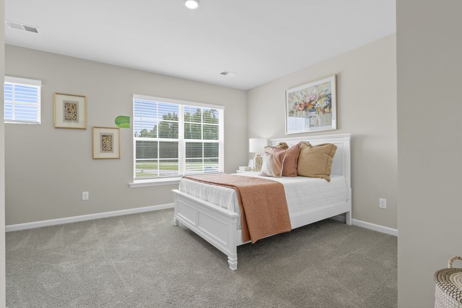 Furnished interior in a model home at Harmon Terrace in Hopkins (Image 24).