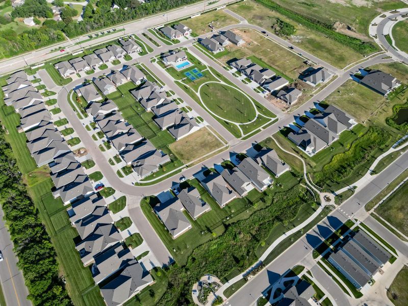 Aerial view of the The Courtyards at The Heritage community in Andover, KS, showing layout and nearby surroundings (Image 27). Aerial view of the The Courtyards at The Heritage community in Andover, KS, showing layout and nearby surroundings (Image 27).