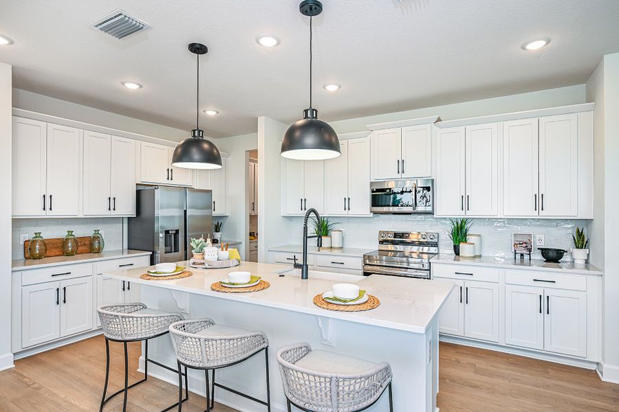 Furnished interior in a model home at Storey Creek in Kissimmee (Image 7).