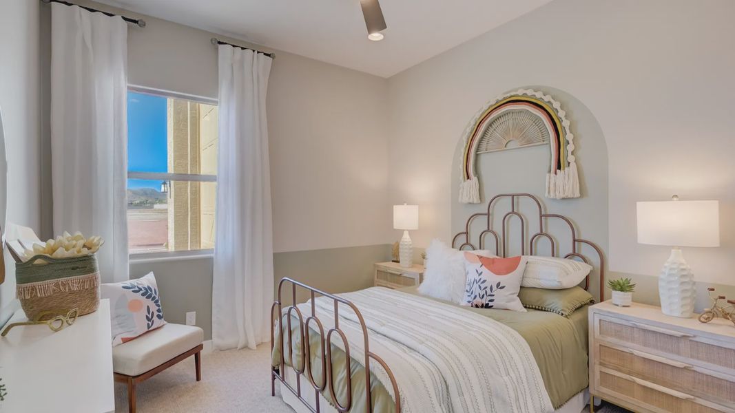 Experience luxury in a serene bedroom with elegant metal bed and chic woven accents at Arroyo Seco Palazzo.