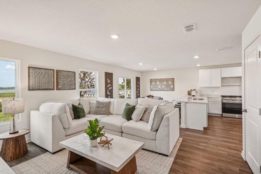 A living room with a white couch. A living room with a white couch.
